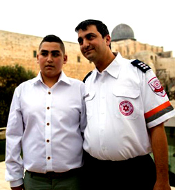 MDA paramedic David Dalfen with Naor Ben-Ezra