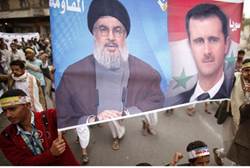 syrian government forces retake town with help from hezbollah fighters